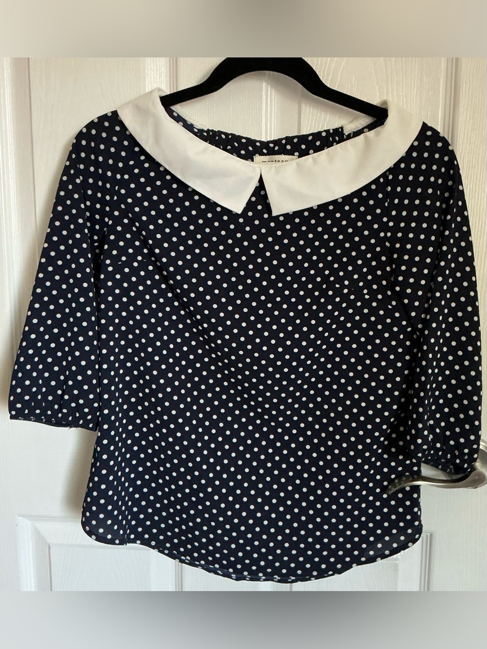 Navy polka-dot blouse